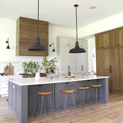 A kitchen with cabinets painted dark grey. S-W featured color: SW 7061 Night Owl