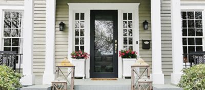 An exterior home entryway with painted brick. SW colors featured: SW 7067 Cityscape.