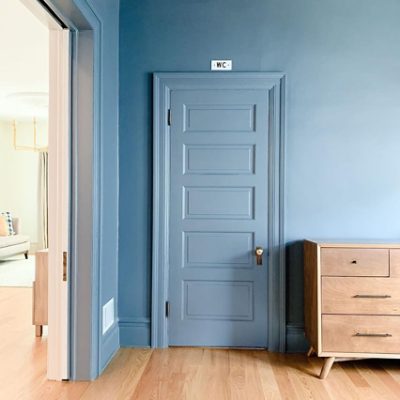 A blue door and wall. S-W color featured: SW 7665 Wall Street.
