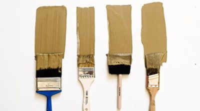 A set of four paint brushes with beige paint. SW color featured: SW 9124 Verde Marron.