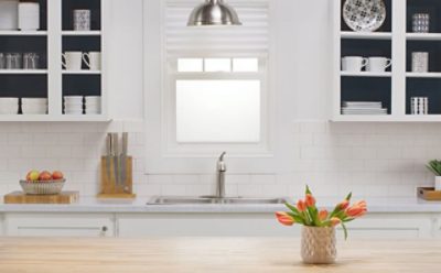 A white painted kitchen with interior navy painted cabinets. SW colors featured: SW 9178.