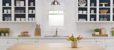 A white painted kitchen with interior navy painted cabinets. SW colors featured: SW 9178.