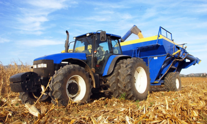 Blue and yellow agriculture machine 
