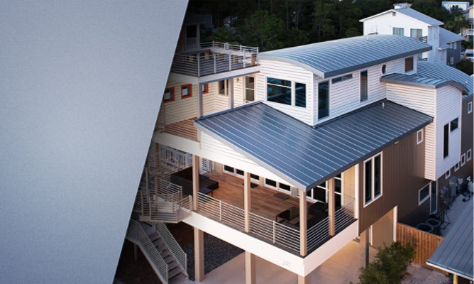  Photo of newly constructed residential home with grey curved metal roofs