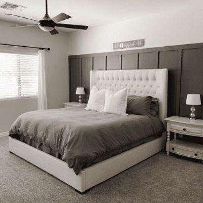 A bedroom with a wall painted in roycroft pewter sw 2848 by @holly_nagel.