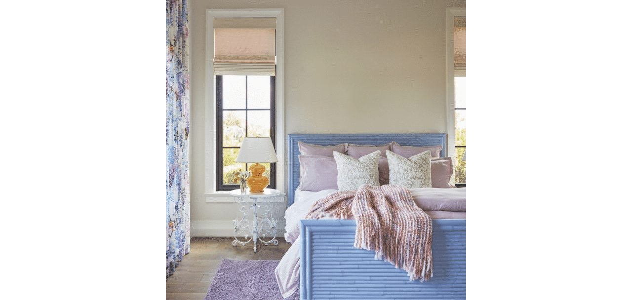 A bright bedroom with tall windows and walls painted in origami white sw 7636 by @jmainteriordesign.