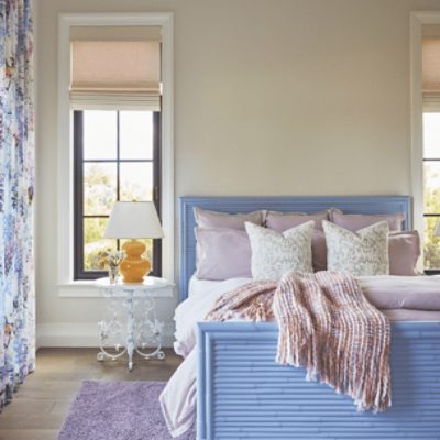 A bright bedroom with tall windows and walls painted in origami white sw 7636 by @jmainteriordesign.