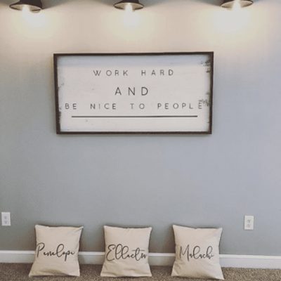 A wall with a framed quote on it painted in lazy gray sw 6254 by @kesha.