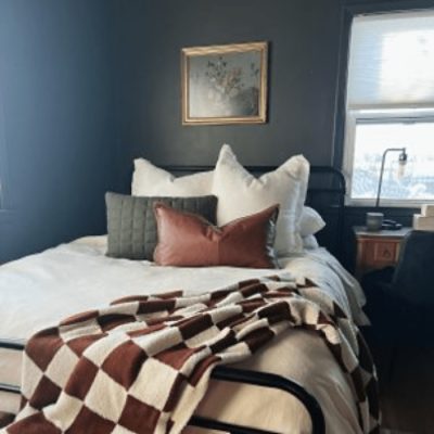 Rustic bedroom painted SW 6244 Naval, Sherwin Williams 2020 color of the year.