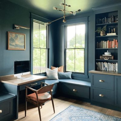 A home office with large window, built in book shelf and walls painted in mount etna sw 7625 by @our_edith_house.