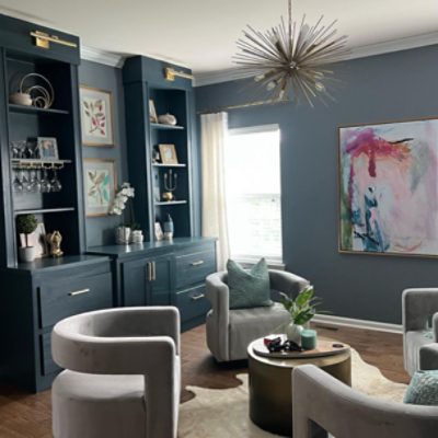 Modern Living Room with cabinets and shelves, chairs, chandelier, decor, done by seaserpent allison talleri interiors.