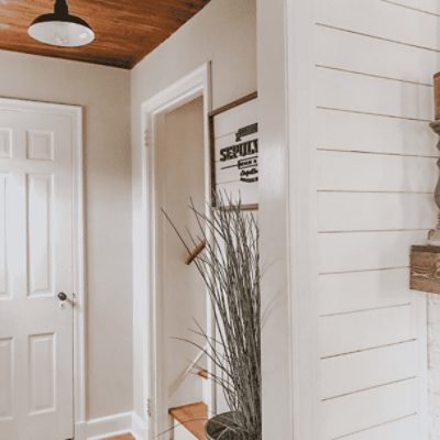 A home hallway painted in popular gray sw 6071 by @seslie_way.