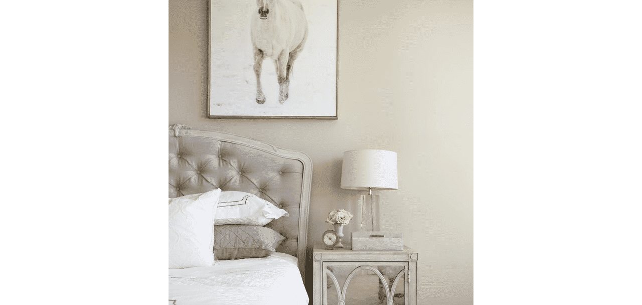 A bedroom painted in worldly gray sw 7043 by @shumanmabeunteriors.