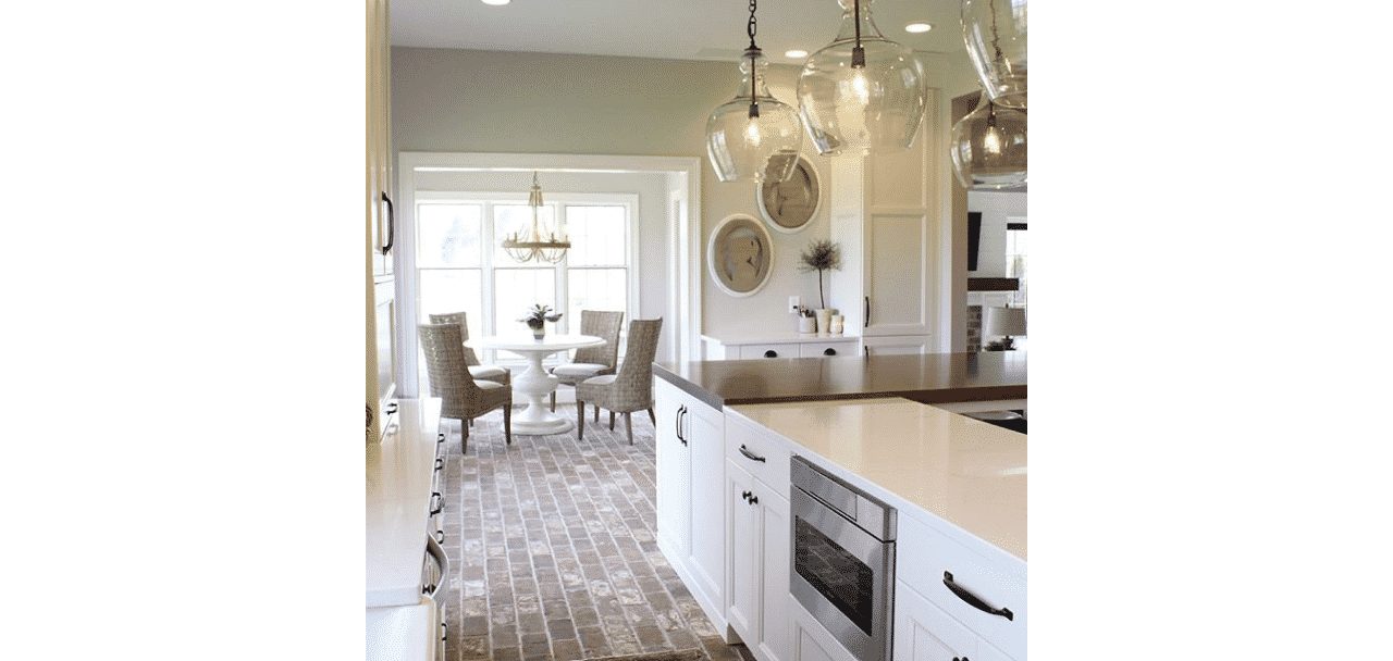 A kitchen painted in worldly gray sw 7043 by @styledbysorells.