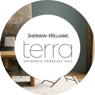 Sherwin-Williams Terra Colormix Forecast 2023 with a modern table and gray-green walls.