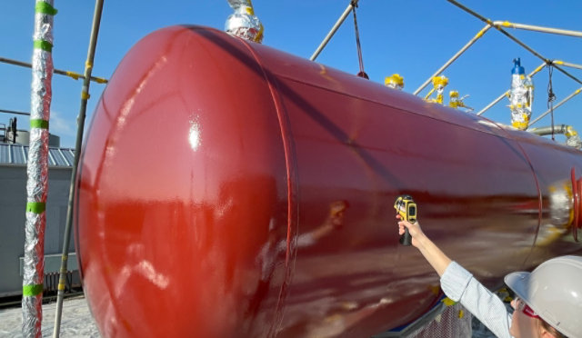 Thermal insulative coating on a tank being measured for temp