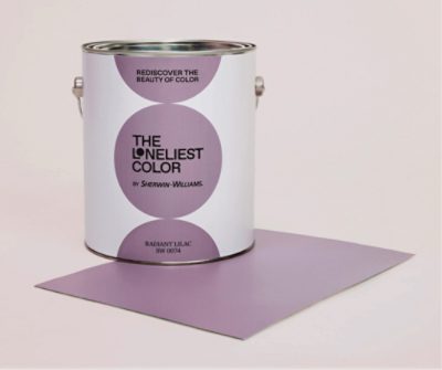 A Loneliest Color branded paint can on top of a Radiant Lilac Peel & Stick sample.