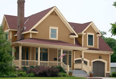 A traditional-style home with red roofing and bronze paint. S-W Colors featured: SW 6124, SW 6120, SW 7048