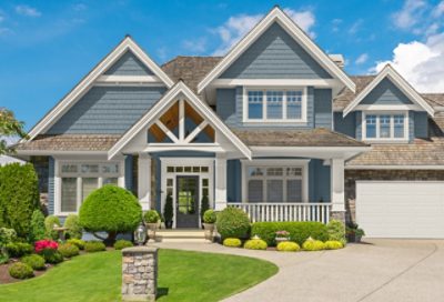 A traditional-style home with light blue paint and white trim. S-W Colors featured: SW 7630, SW 7631, SW 7674