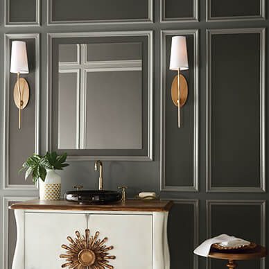 A dark painted living room with a glass mirror.