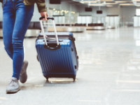 person walking down airport holiday