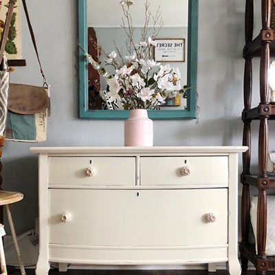 A white upcycled dresser with flower vase. S-W colors featured: SW 9180.