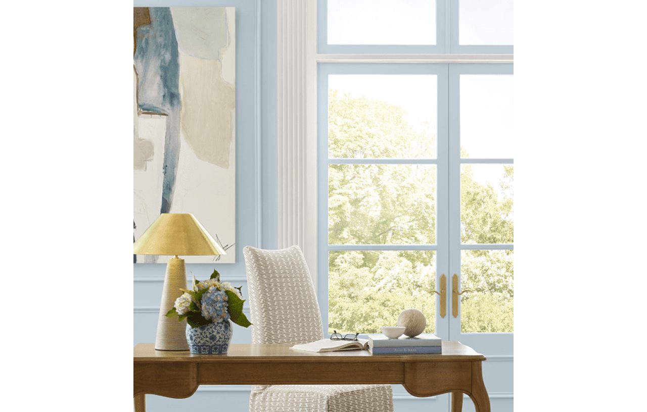 A home office with the walls and French doors painted Upward SW 6239.