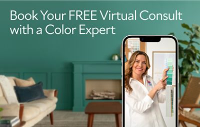 A phone showing a virtual color consultation with a woman holding up a fan deck and text saying book your free virtual color consult with a color expert.