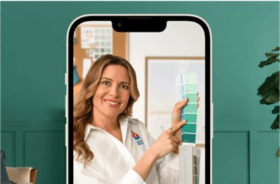 An iphone promoting a virtual color consultation with a person holding up some color cards.