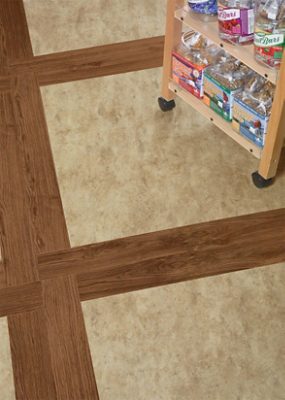 A snack cart on top of vinyl plank flooring.