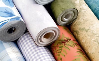 A set of rolled up wallpaper with patterns.