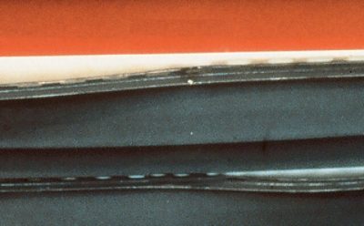 A piece of siding with warped vinyl.