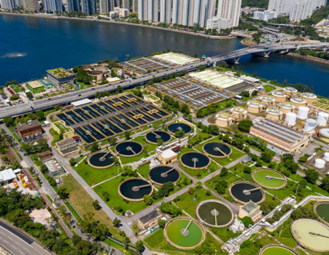 Wastewater treatment plant with clarifiers and tanks