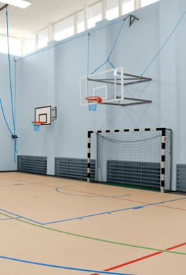 A basketball court with doors, trim and other accents painted Outerspace SW6251.