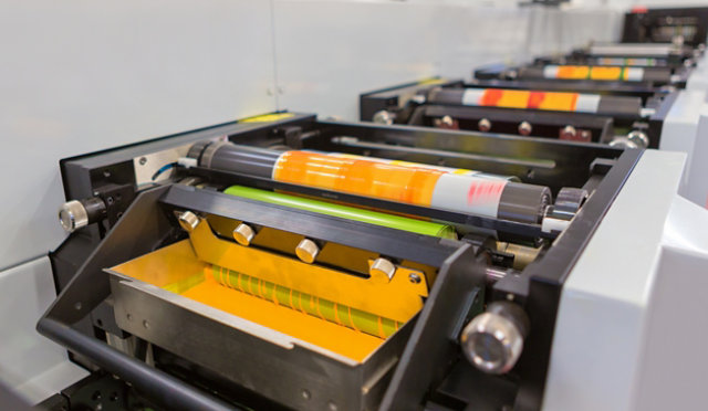 Industrial machinery involved in a production process, possibly related to printing or manufacturing